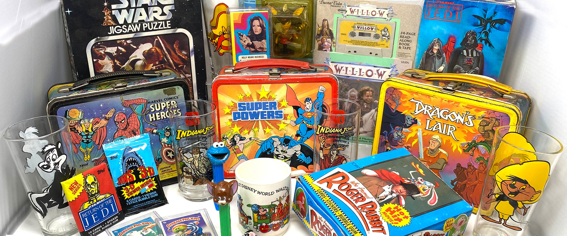 Image of vintage items including lunchboxes, glassware, non-sports cards and more.